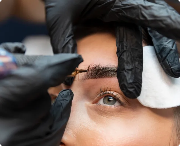 Artist Nancy Lin microblading a female client